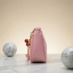 Chic Pink Coach Handbag with Cherry Charms - Image 3
