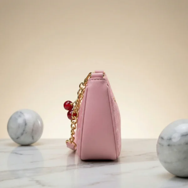 Chic Pink Coach Handbag with Cherry Charms - Image 3